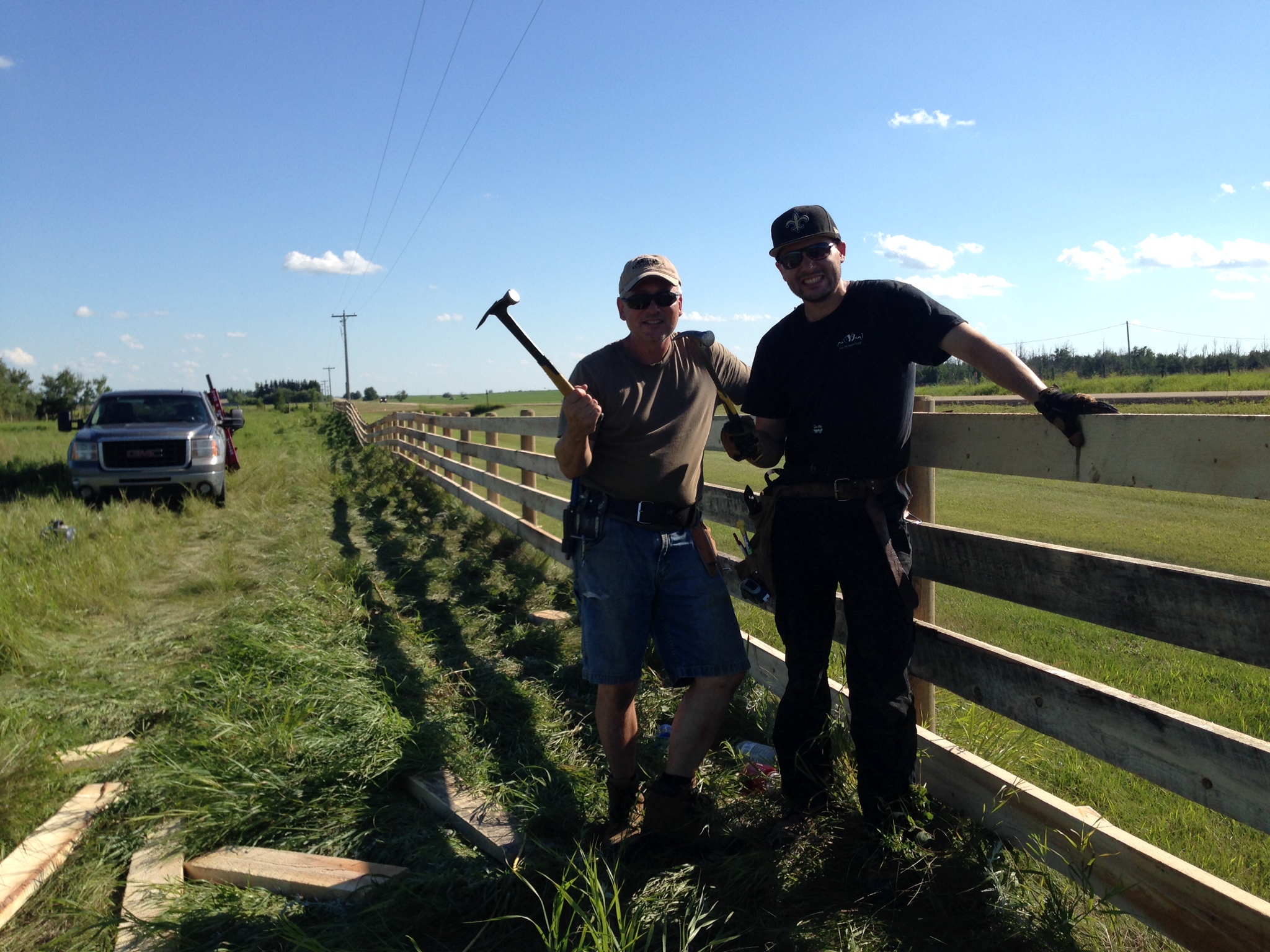 Alberta Wild West Fencing team with 4-plank lumber fence